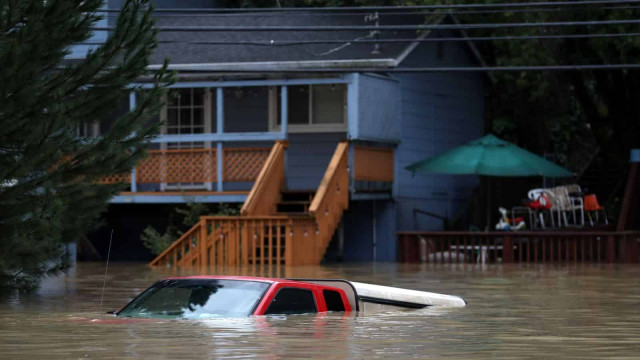 California town 'officially an island' after flooding in two-day storm