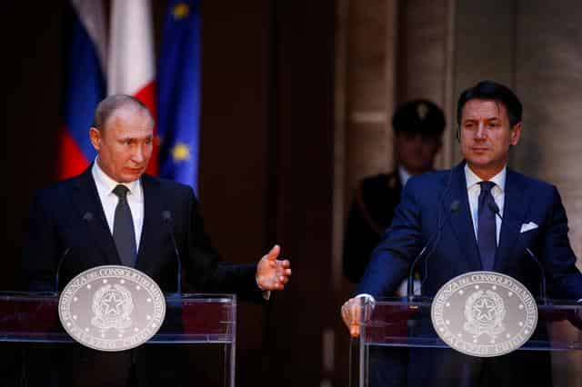 Putin, visiting Italy, says wants Rome to help mend Moscow-EU ties