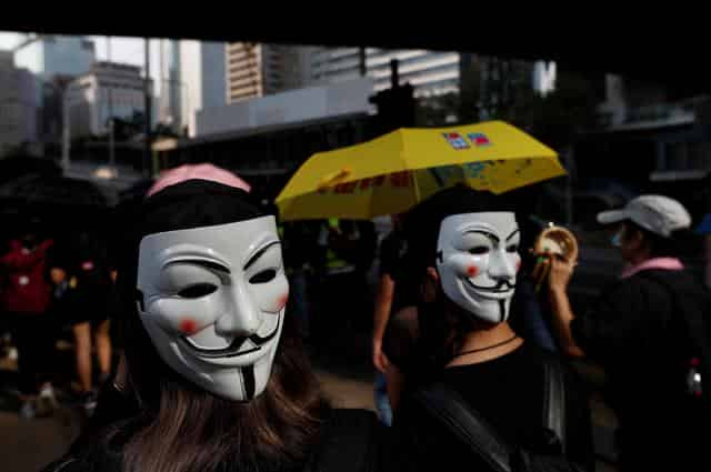 Hundreds return to Hong Kong streets as metro, shops shut after violence