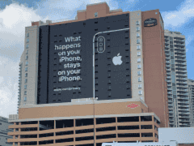 Apple has a message for Amazon and Google and it's plastered on the side of a hotel at the biggest tech conference of the year