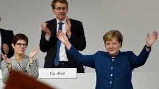 Angela Merkel passes torch to new party leader