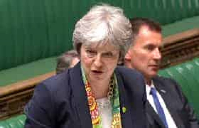 With warning and EU letter, May tries to pull MPs behind Brexit deal