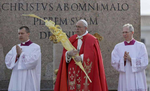 Pope Francis blesses palm branches as he ushers in Holy Week