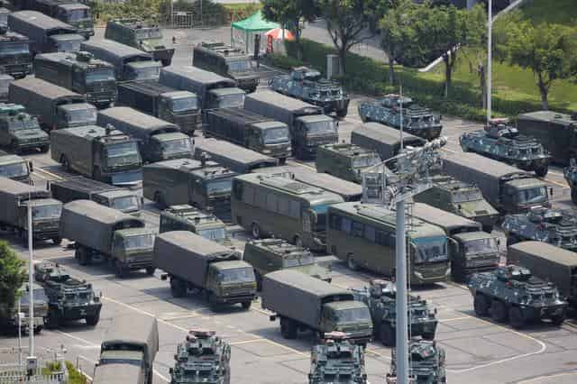 In 'clear warning', Chinese paramilitary forces exercise near Hong Kong