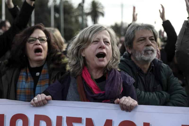 Striking Greek state school teachers march through Athens