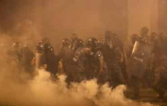 Beirut police fire tear gas as protesters regroup and two ministers quit