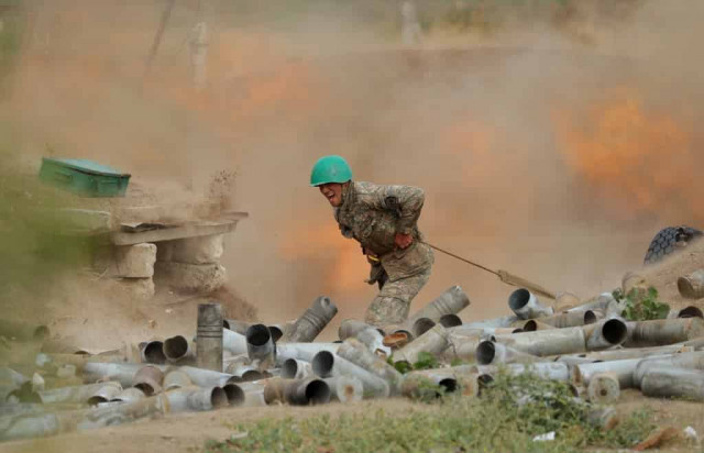 Corpses and burnt-out cars line Karabakh road as Russian troops deploy